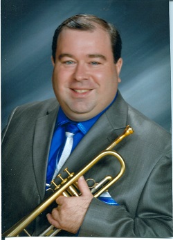 Vince Pettinelli portrait shot with trumpet